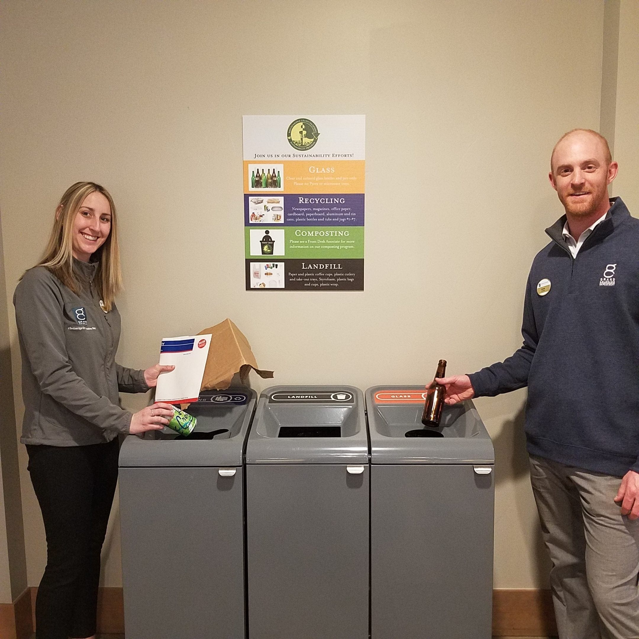 Breckenridge Grand Vacation employees recycling as part of their practices for green lodging in Breckenridge