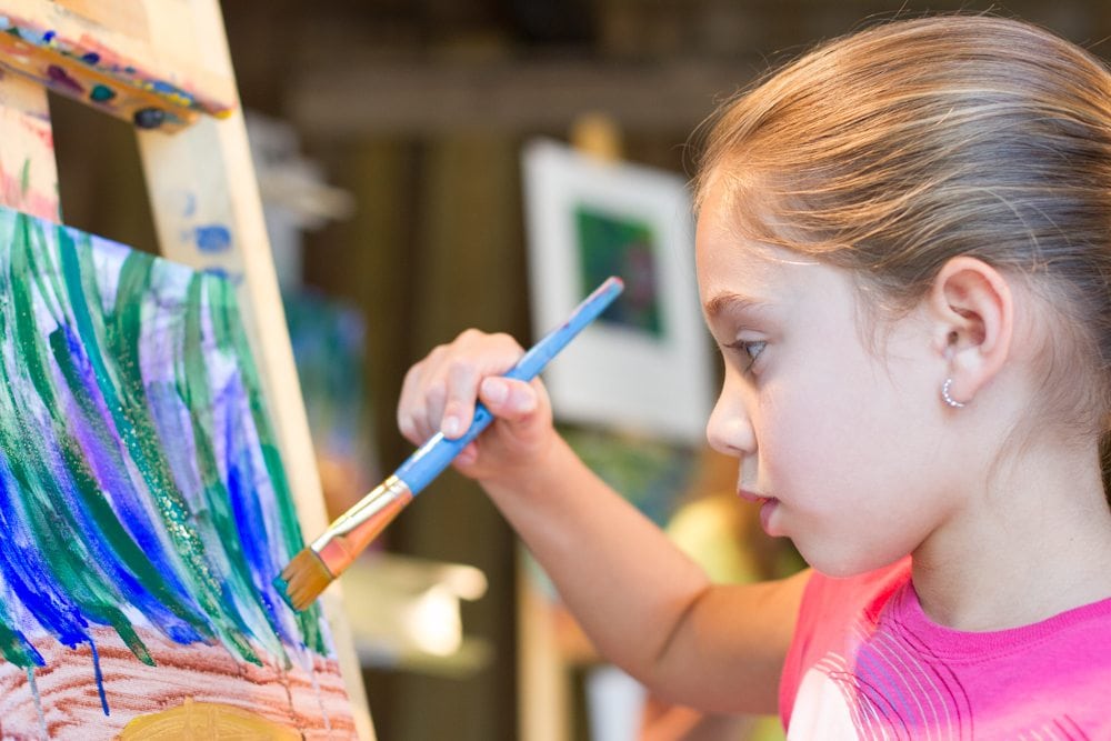 A girl painting in the Arts District in Breckenridge.