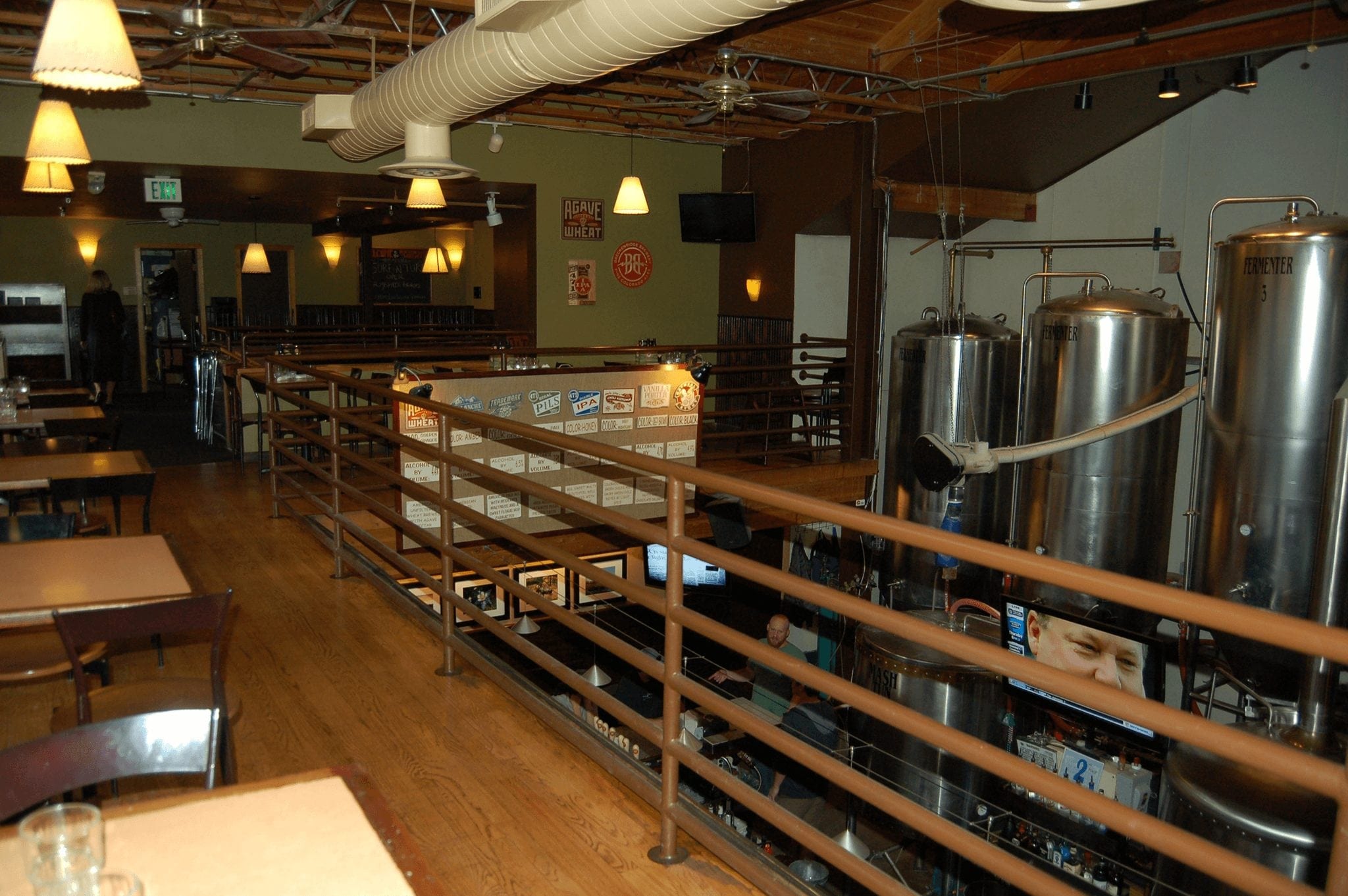 Brew tanks next to bar tables in Breckenridge Brewery