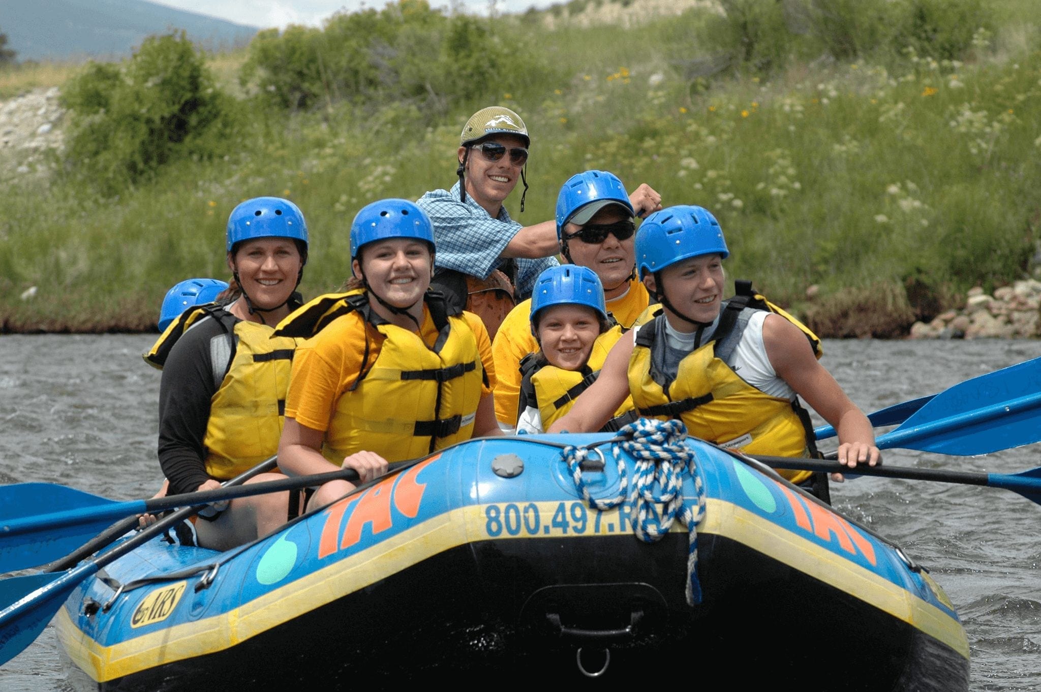 A family and kids raft together in Breckenridge