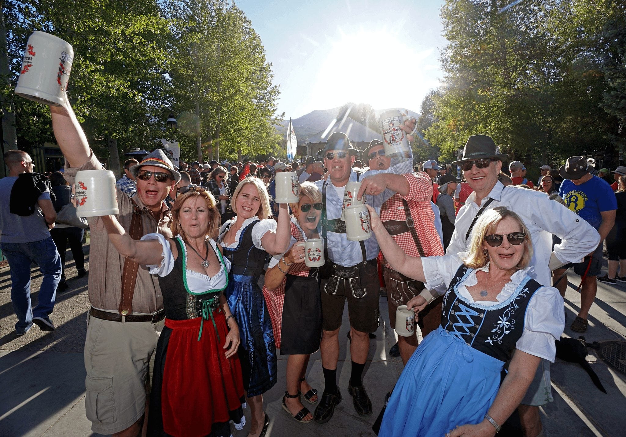 A group celebrating Oktoberfest in Breckenridge with steins