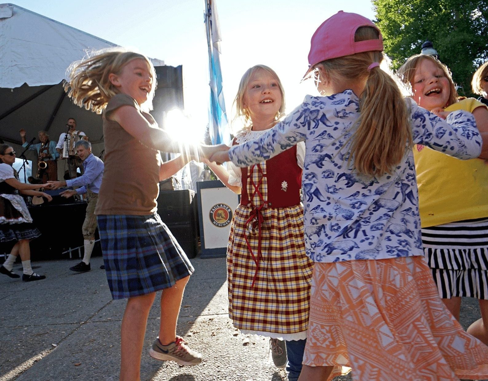 Kids dancing in a circle during Oktoberfest