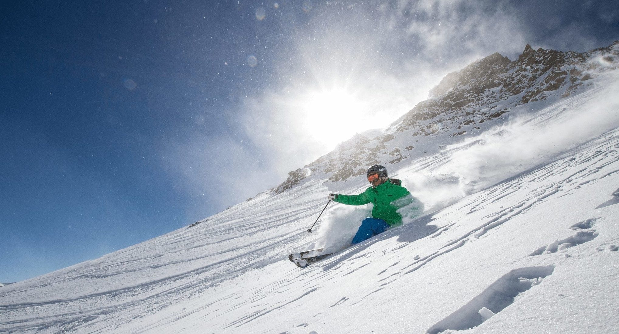 Man skiing on powder in Breckenridge.