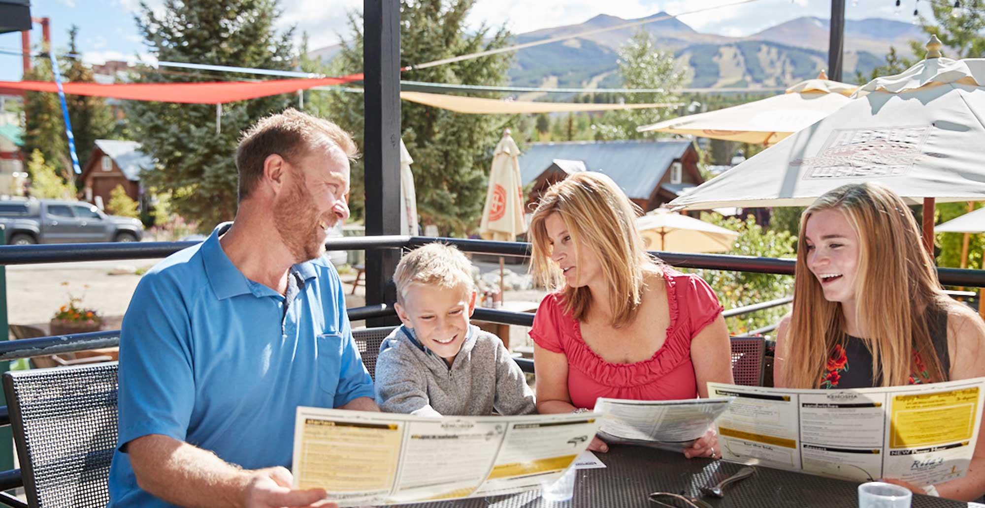 family eats lunch on outdoor patio of Kenosha