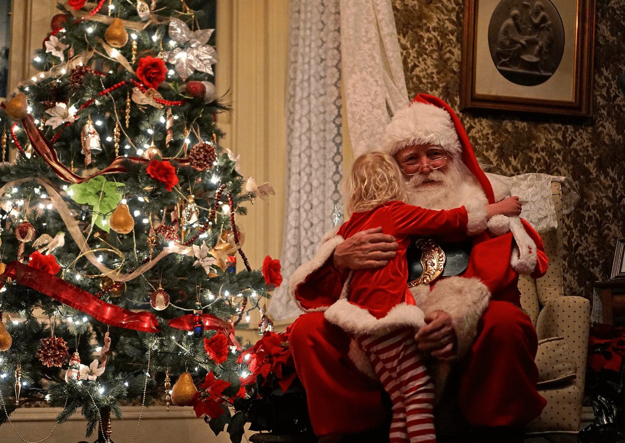 Girl Hugging Santa during the Holidays in Breckenridge