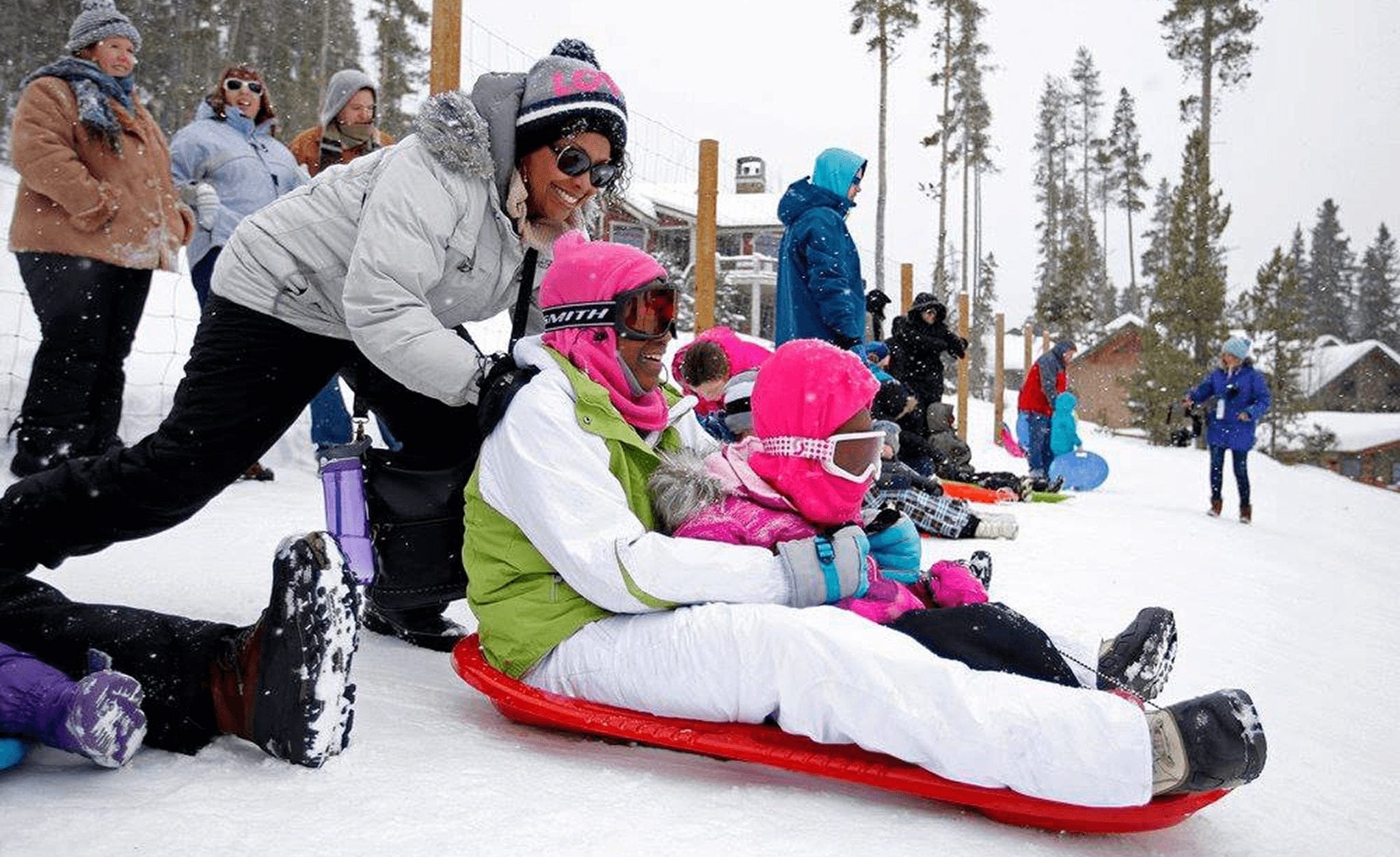 A family sledding at Carter Park in Breckenridge.