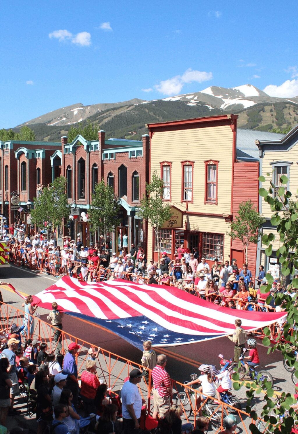 Overhead view of boyscouts carrying the American flag for Independence Day parade