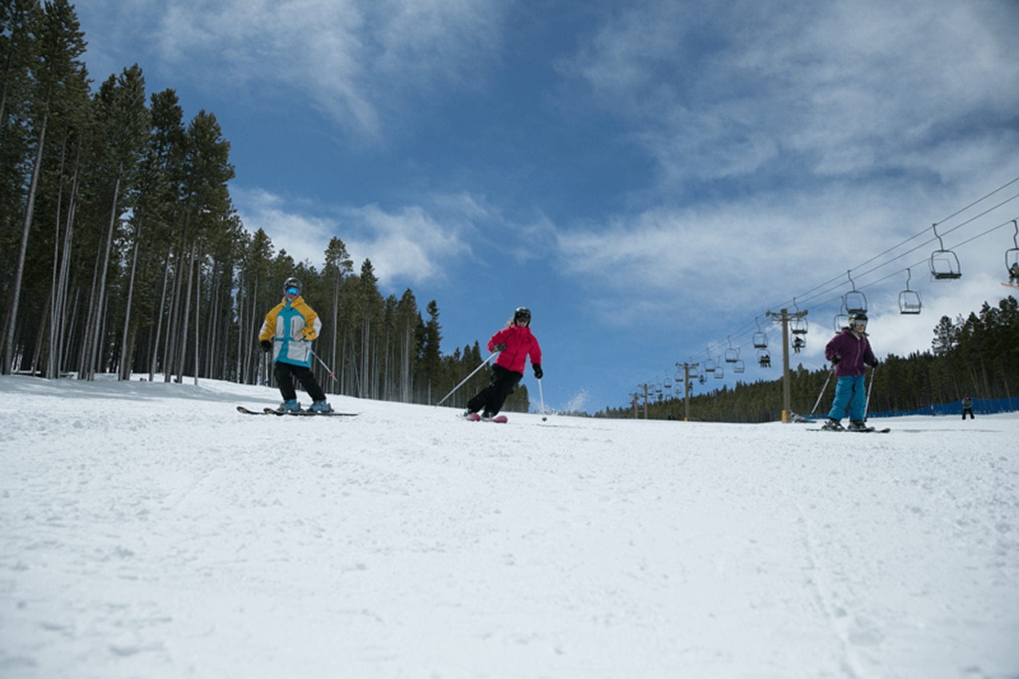Kids skiing down one of Breckenridge's beautiful trails
