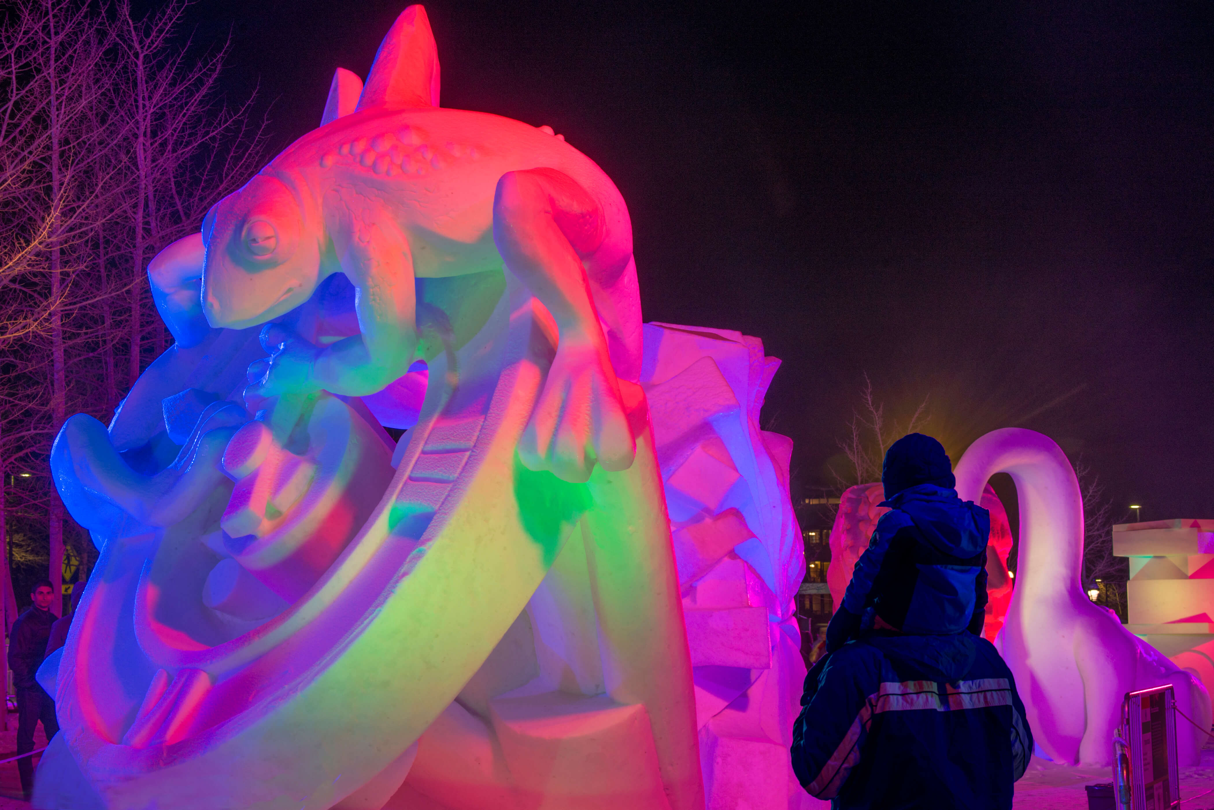 A dad and kid at the International Snow Sculpture Championships