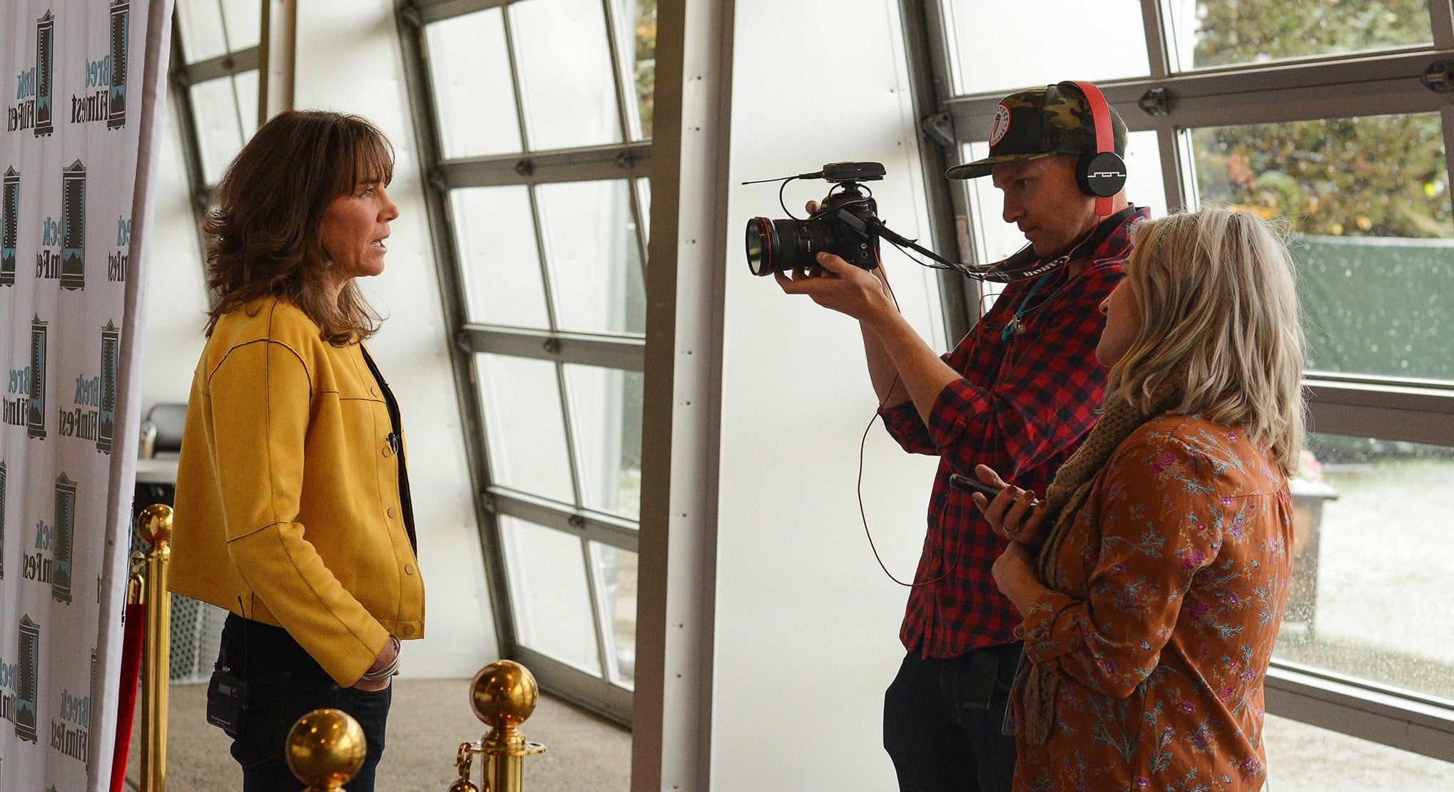 An interview with a film crew on the red carpet at Breck Film Fest.