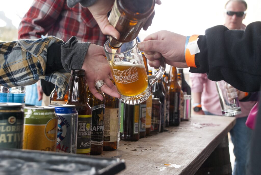 pouring beer into a glass