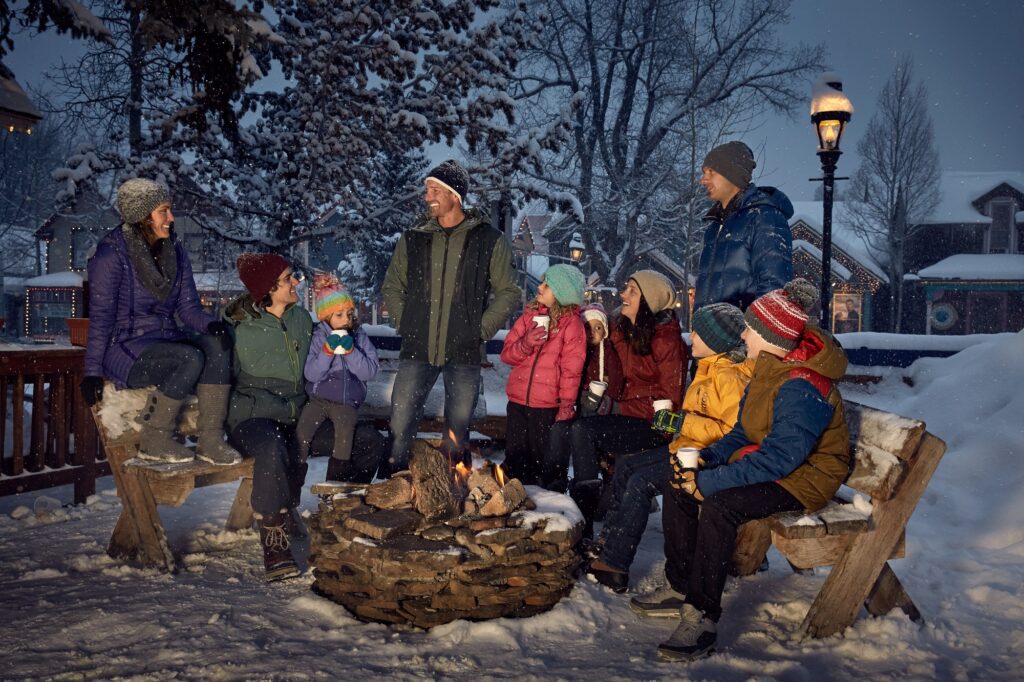 blue stag fireplace with a group of friends