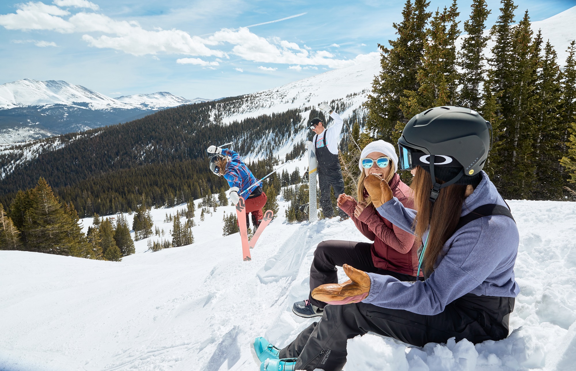 Friends watching a skier take a jump in Breckenridge