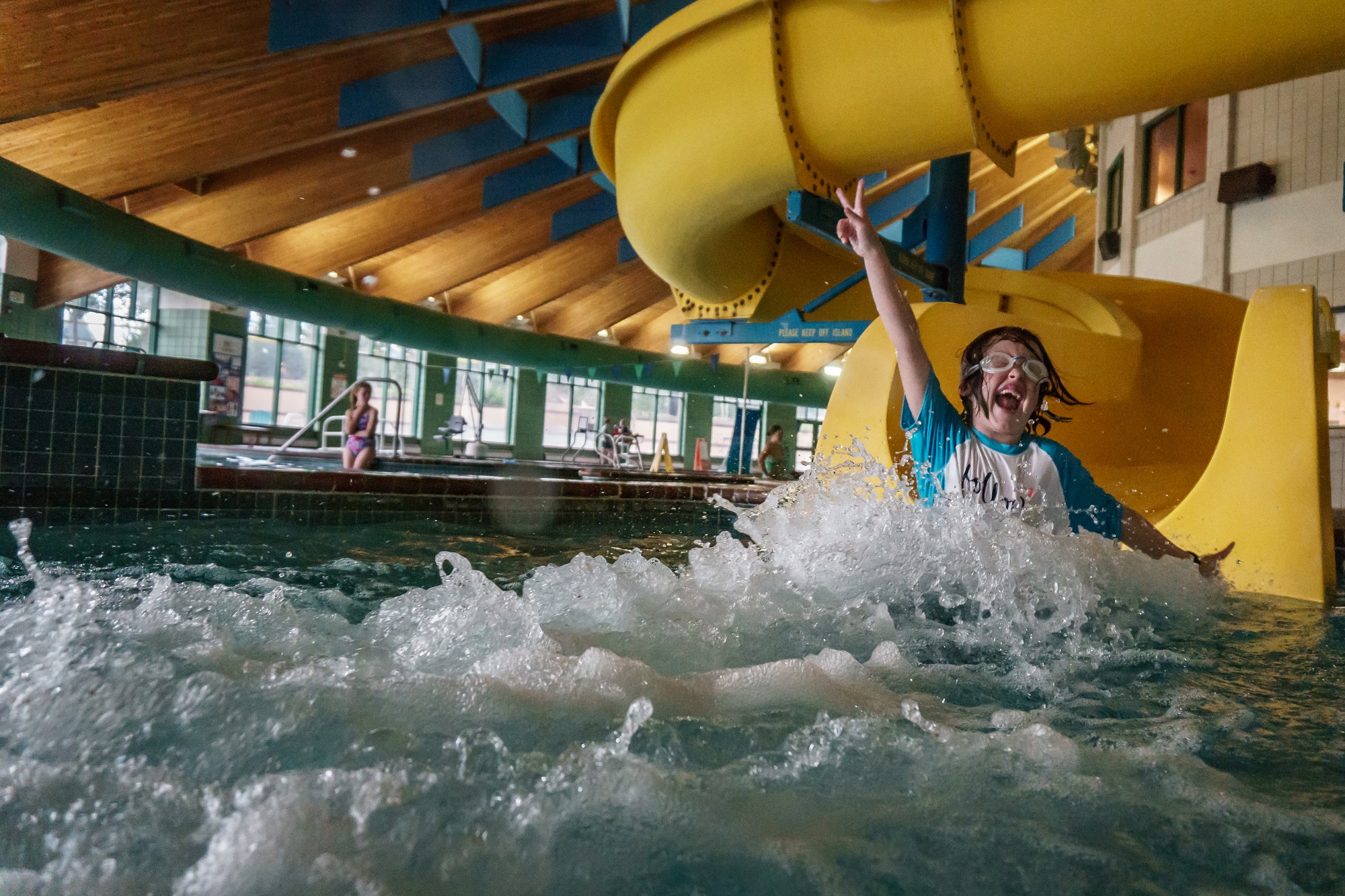 Kids coming down the Shoot the Summit Plummit waterslide at the Breckenridge Rec Center.