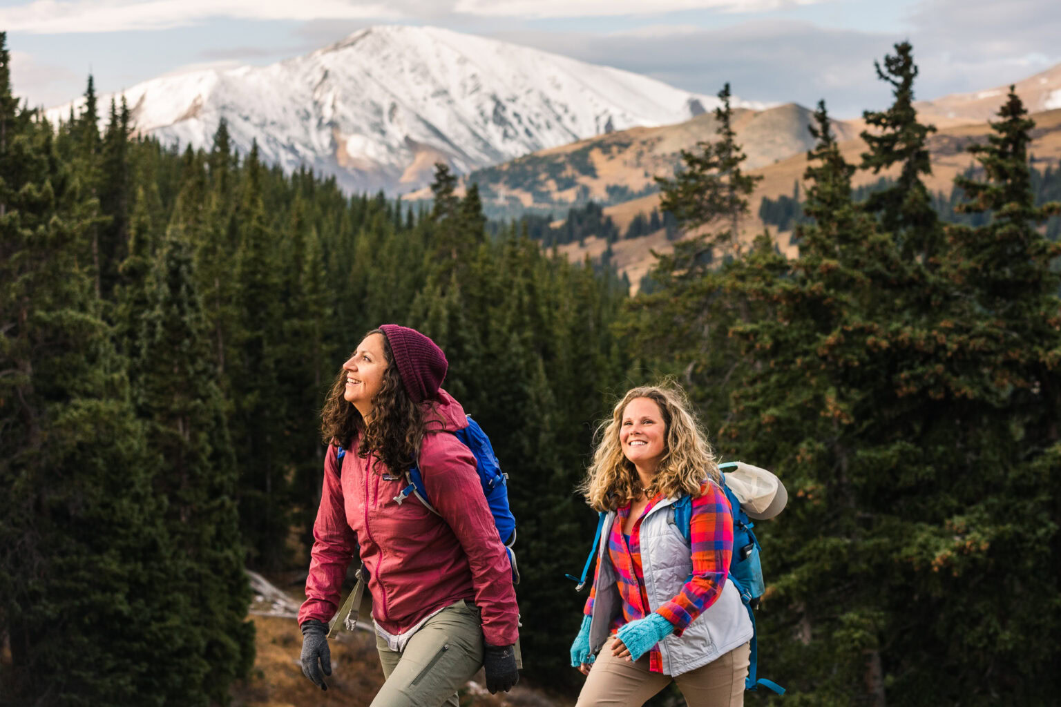 women hiking with a mountain view