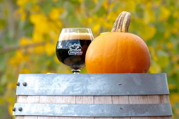beer and a pumpkin on a barrel
