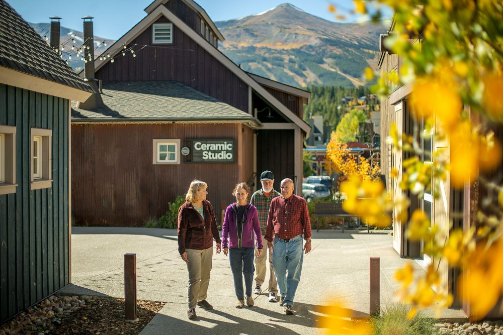 A group of people wandering through Breck's Art District