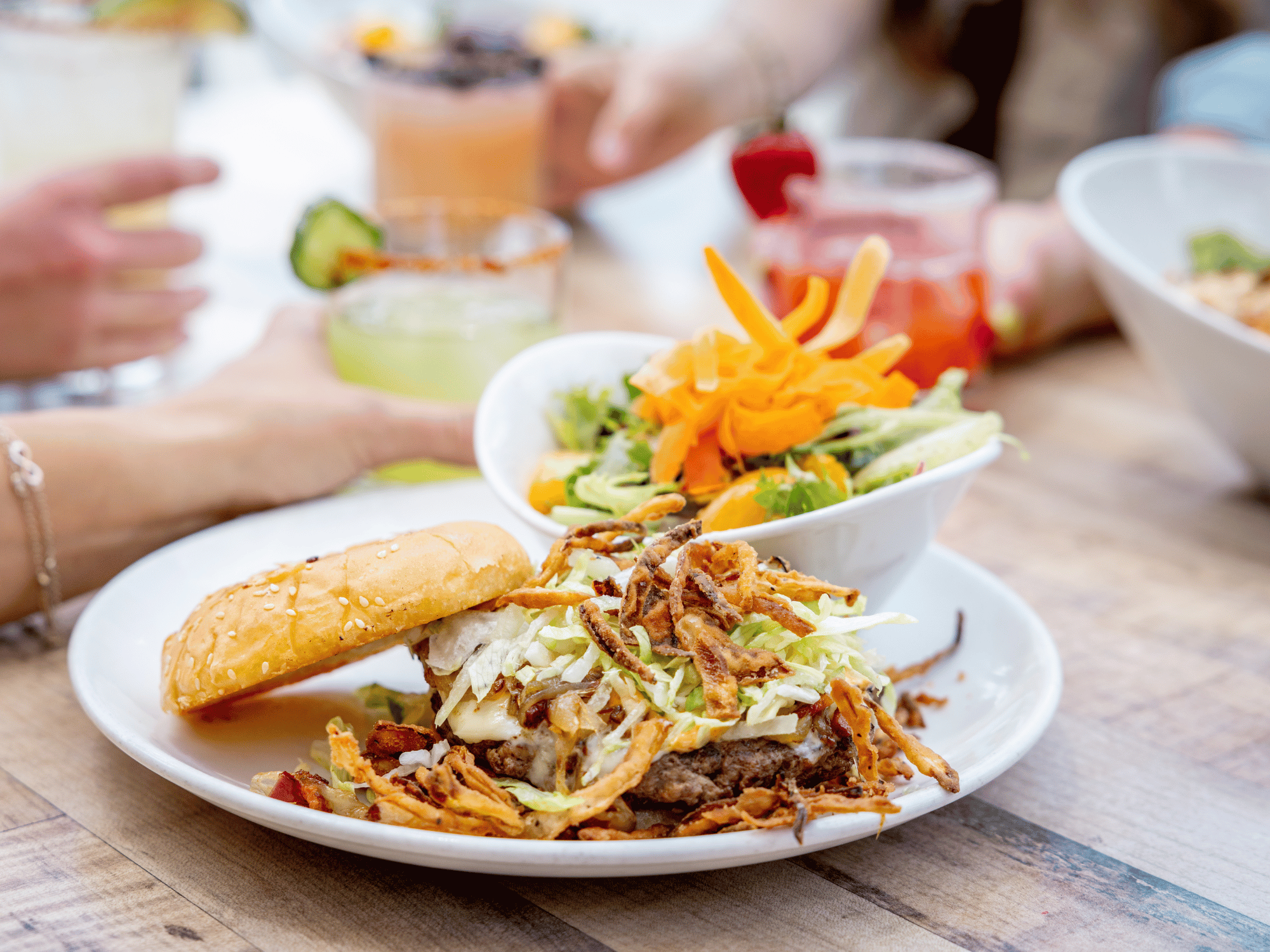 An upscale burger and side salad