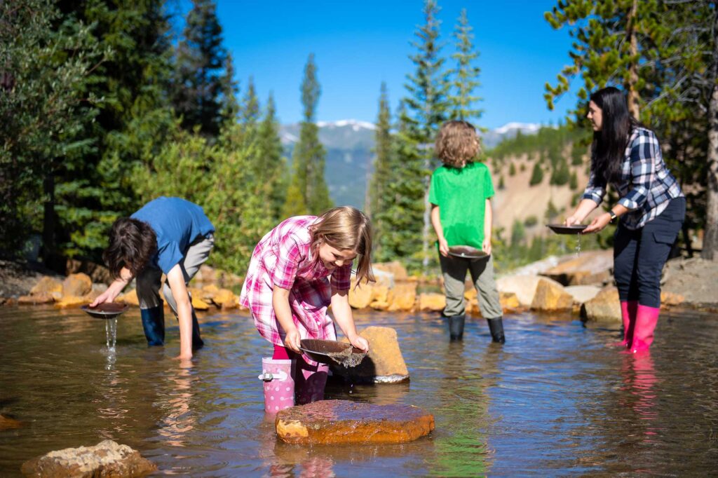 Family panning for gold in Breckenridge