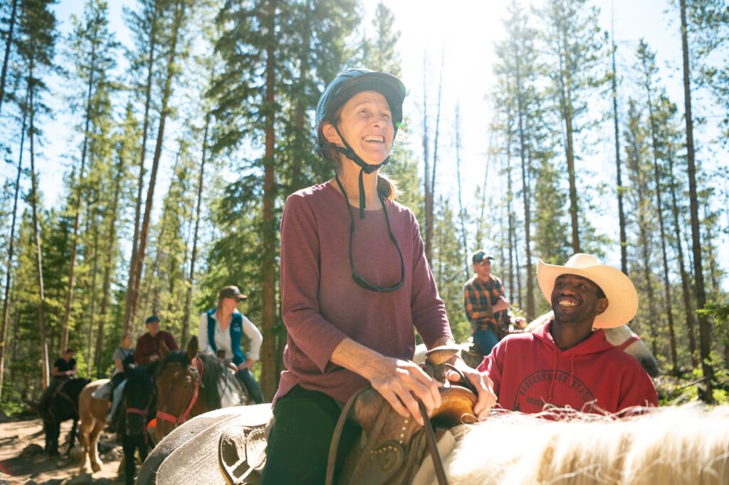 Elderly women horseback riding