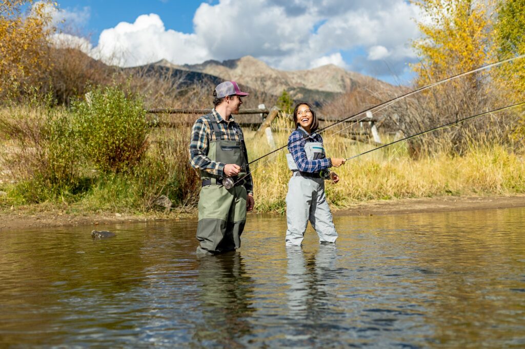 Couple fly fishing