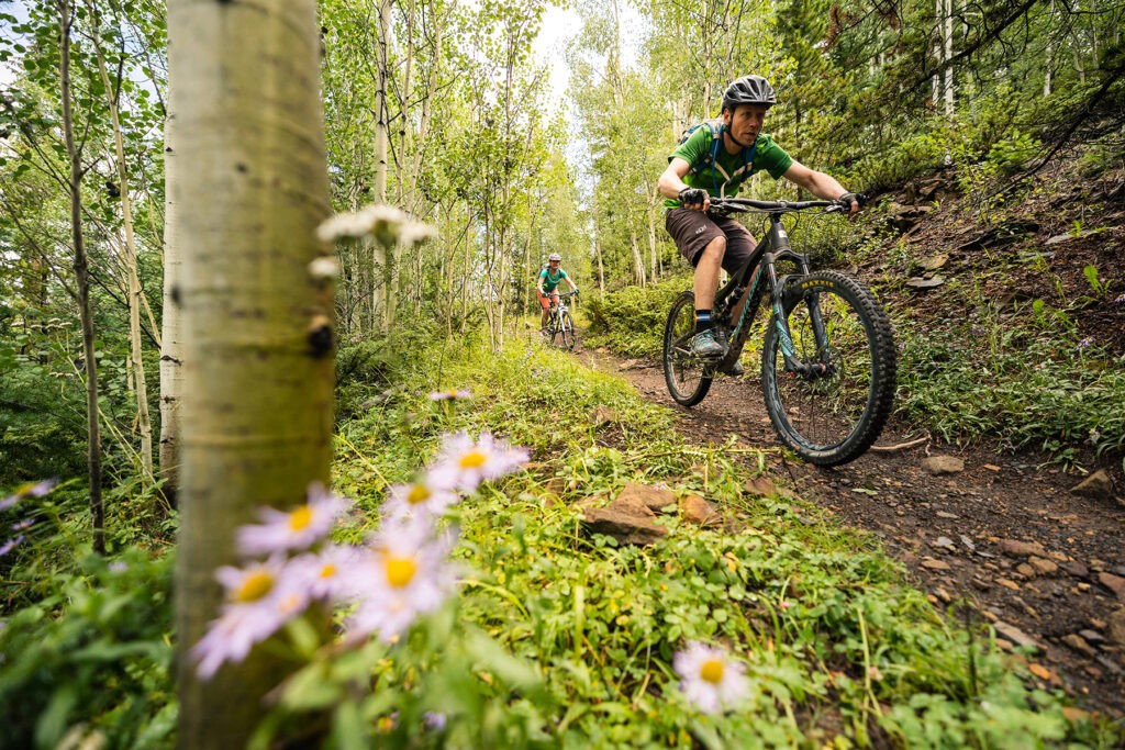 two people mountain biking